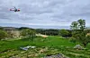 Berning tende røykpatroner for å markera kor helikopteret kunne landa.
