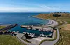 Obrestad hamn er den største av dei gamle, kunstige hamnene på Jæren. Ho er freda av Riksantikvaren. Frå boka.