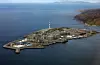 I juli 2002 gjennomførte «Natur og Ungdom» fleire aksjonar i protest mot bygginga av det nye gassfeltet «Snøhvit» utanfor Hammerfest. På biletet er Equinors anlegg på Melkøya for mottak av gass frå Snøhvit-feltet.